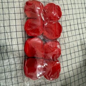 Red rose petals for a flower girl
